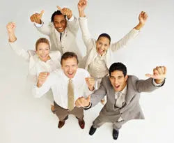 Five business colleagues cheering with arms raised, smiling and looking up, conveying workplace wellness and team morale