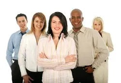 Five smiling wellness professionals standing together against a white background