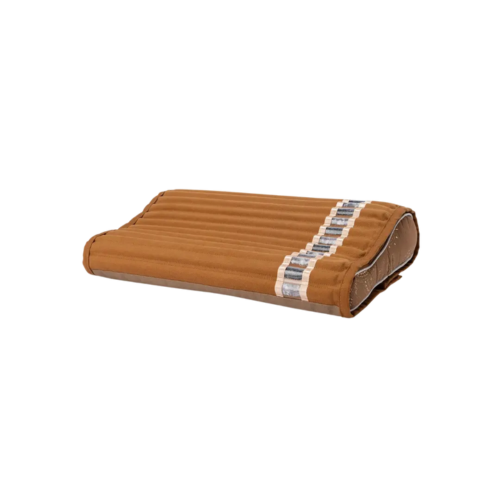 Angled front view of Amethyst Pillow showcasing quilted brown cover and amethyst crystal side strip on white background